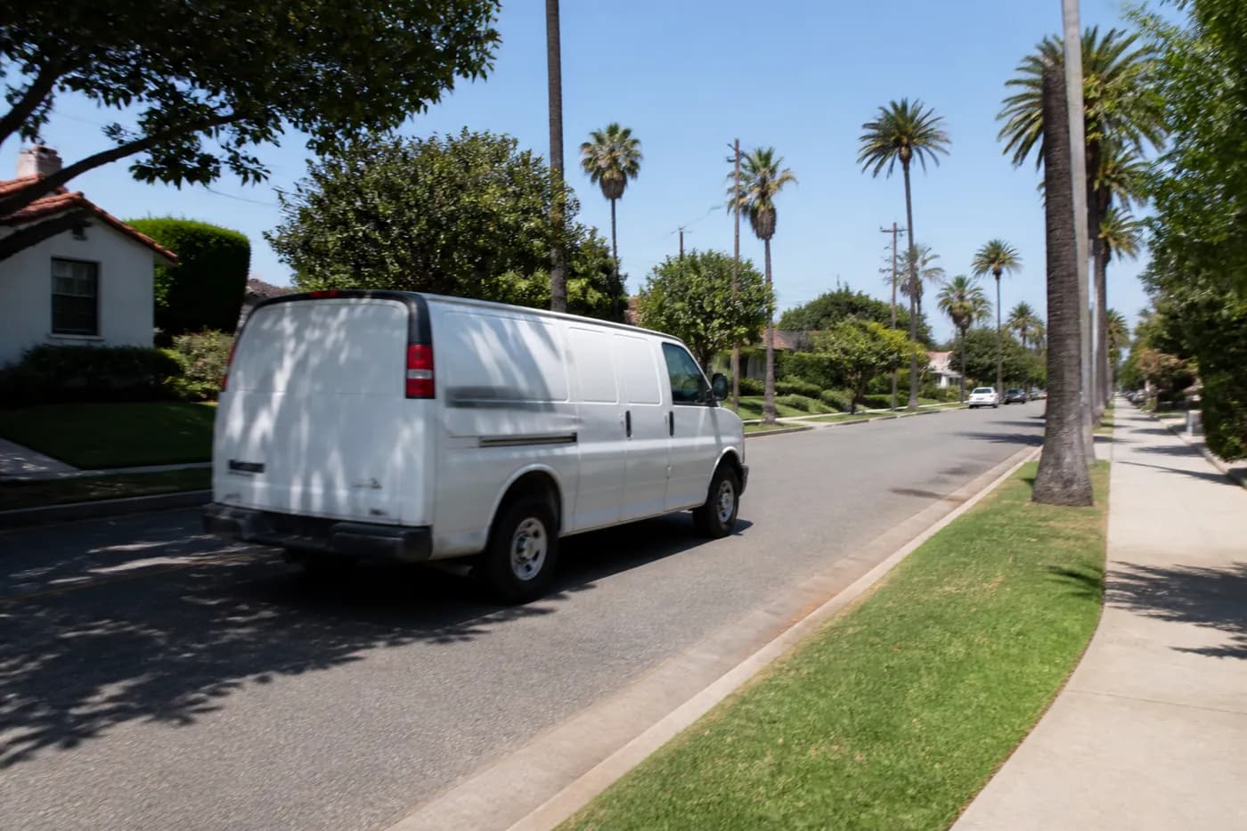 Work van rolling down the street
